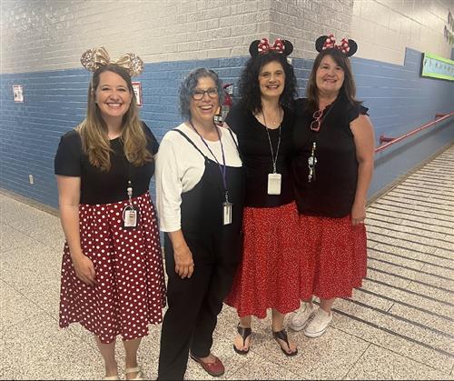 four faculty members smiling at Madison Elementary
